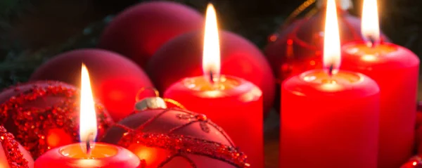 Christmas red candles with candle light and decoration