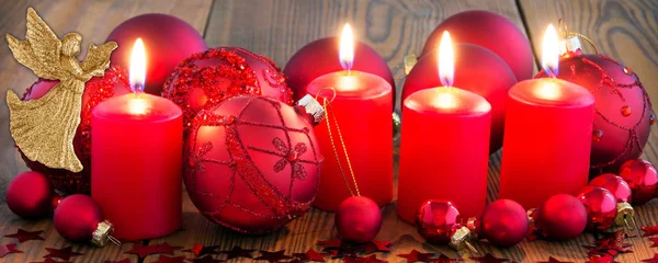 Christmas red candles with candle light and decoration — Stock Photo, Image