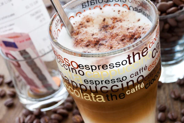 Cafe Latte with coffee beans in glass