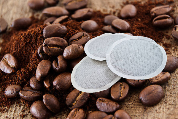Coffee beans and coffee powder as background