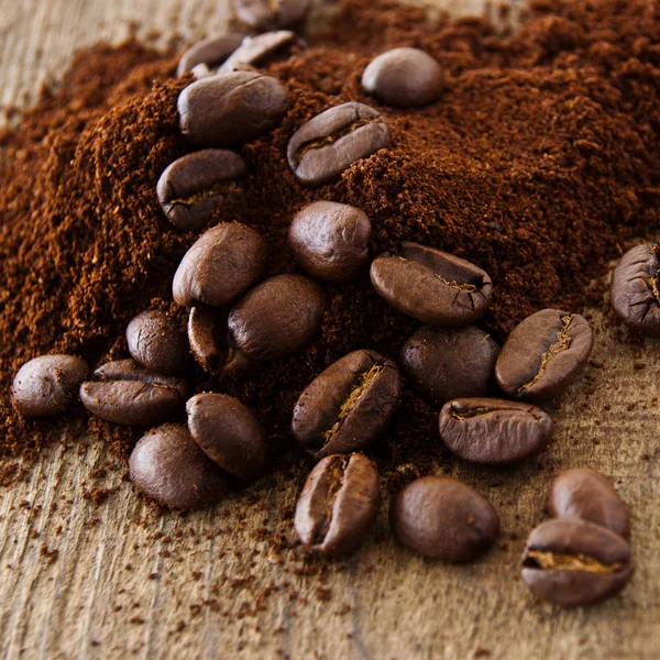 Coffee beans and coffee powder as background Stock Image