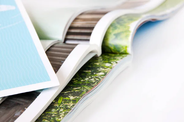 Stack of magazines with white background — Stockfoto