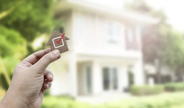 Hand holding brown paper , Home inspection — Stock Photo, Image