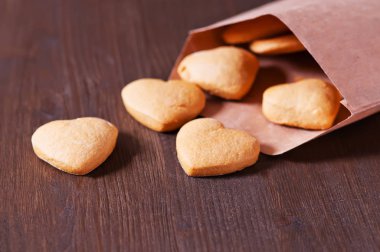 Cookies with  on wooden background.