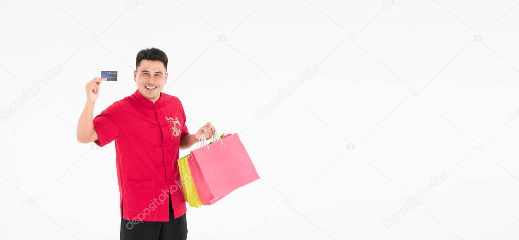 A young Asian man is enjoying shopping.