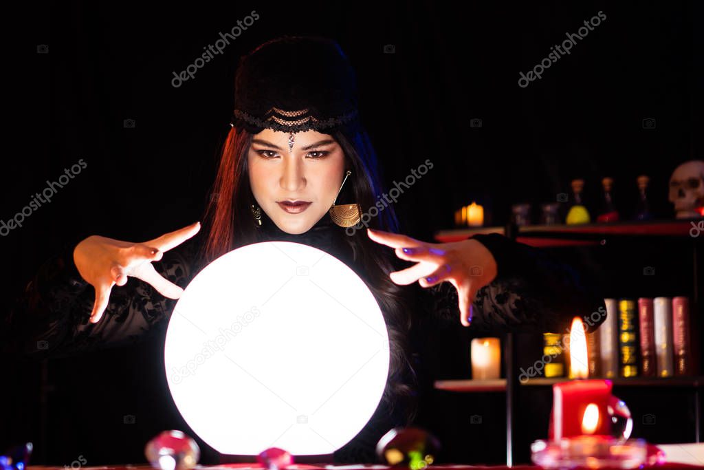 The witch is casting a spell to perform a ritual.