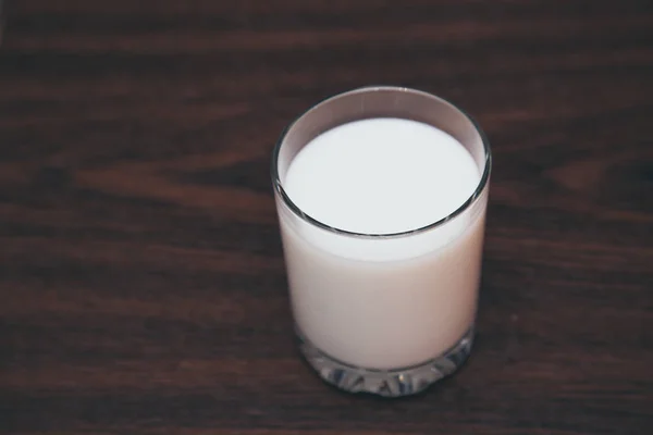 Glass of milk on wooden background — Stock Photo, Image