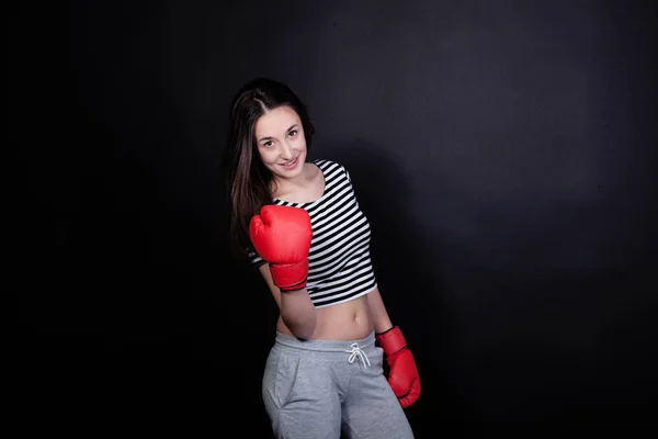 Pretty young sport woman with boxing gloves — Stock Photo, Image