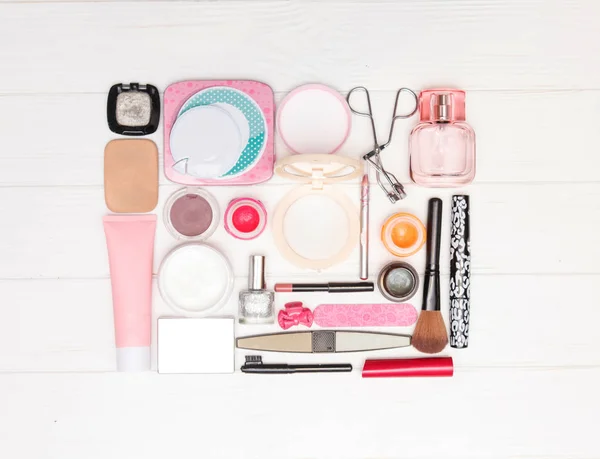 Makeup cosmetics and brushes is lined in the form of a square — Stock Photo, Image