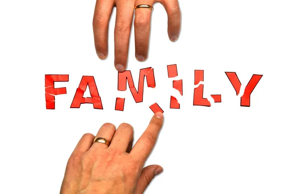 Η λέξη "οικογένεια" και δύο χέρια — Φωτογραφία Αρχείου