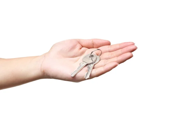 Hand handing a keys — стоковое фото
