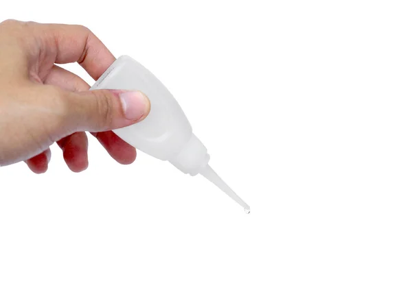 Hand holding a hot glue tube — Stock Photo, Image