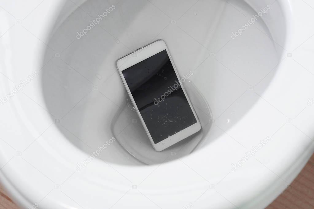 smartphone dropped into a toilet