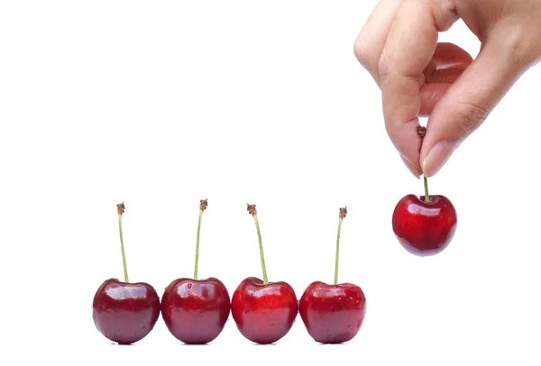 Hand picking up cherry — Stock Photo, Image