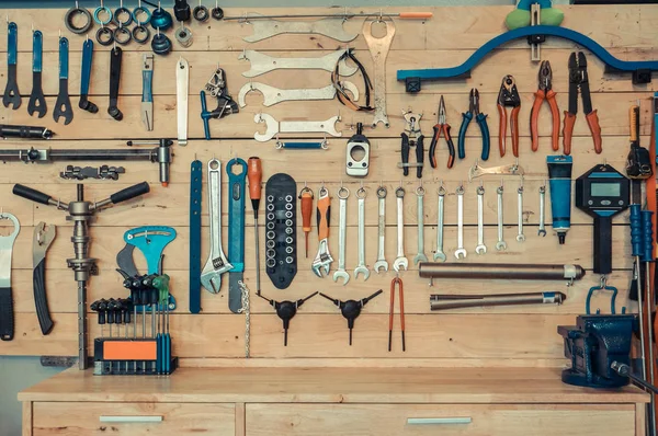 Bicycle tools on wooden shelve — Stock Photo, Image