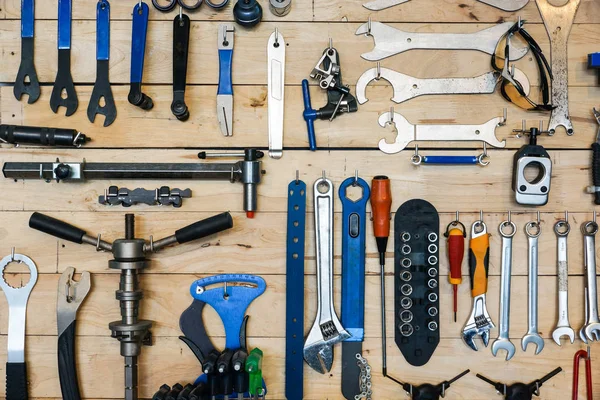 Bicycle tools on wooden shelve — Stock Photo, Image