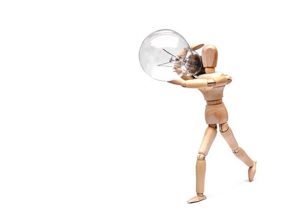 Mannequin carrying light bulb — Stock Photo, Image