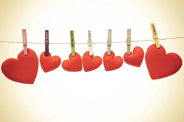 Red hearts hanging on rope — Stock Photo, Image