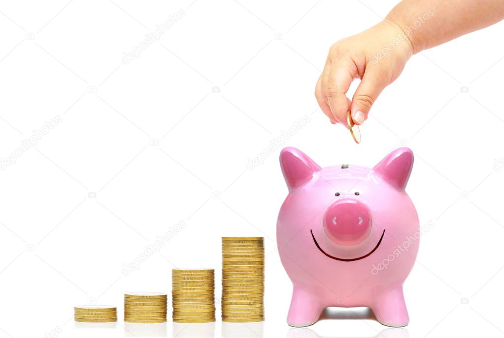 Baby giving coin to piggy bank