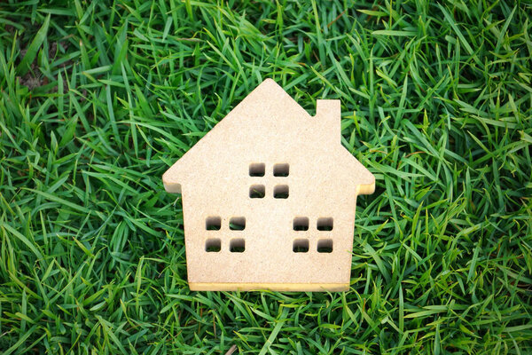 Wooden house on green grass