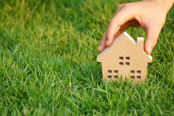 Wooden house on green grass