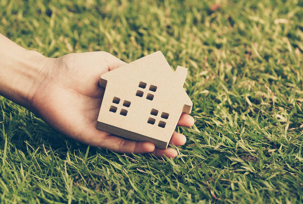 Wooden house on green grass