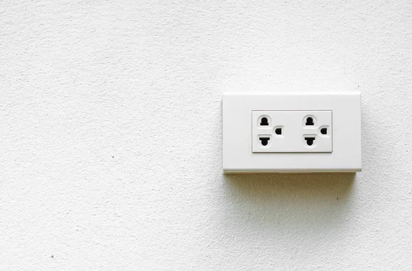 Electricity socket on concrete wall — Stock Photo, Image