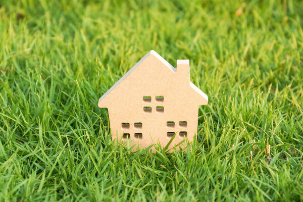 Wooden house on green grass
