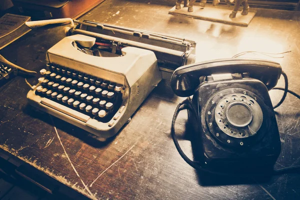 Old telephone and type writer