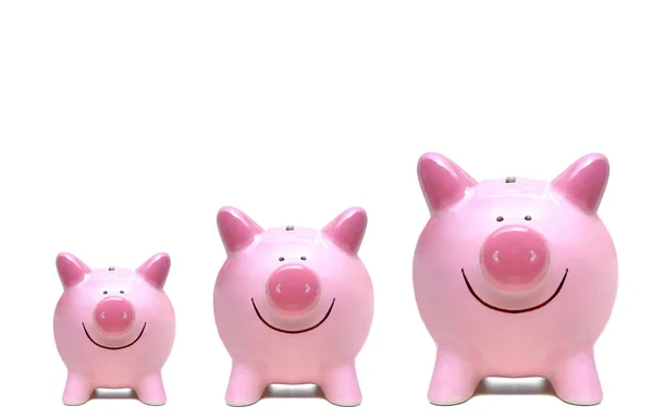 Roze piggy banks in drie verschillende maten — Stockfoto