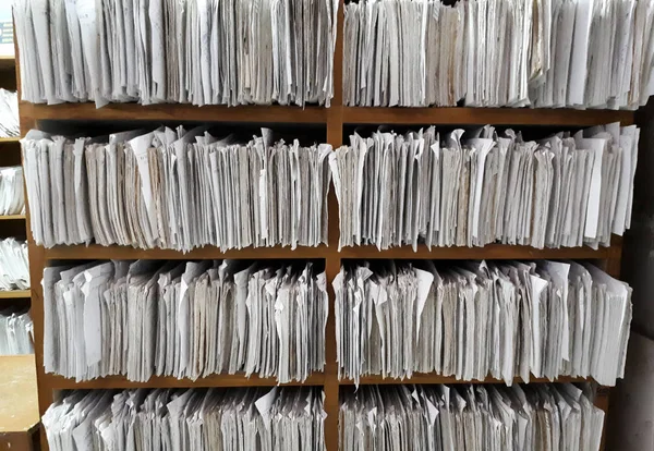 A cupboard full of paper files