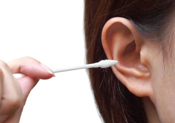 Removing ear wax using a cotton bud — Stock Photo, Image