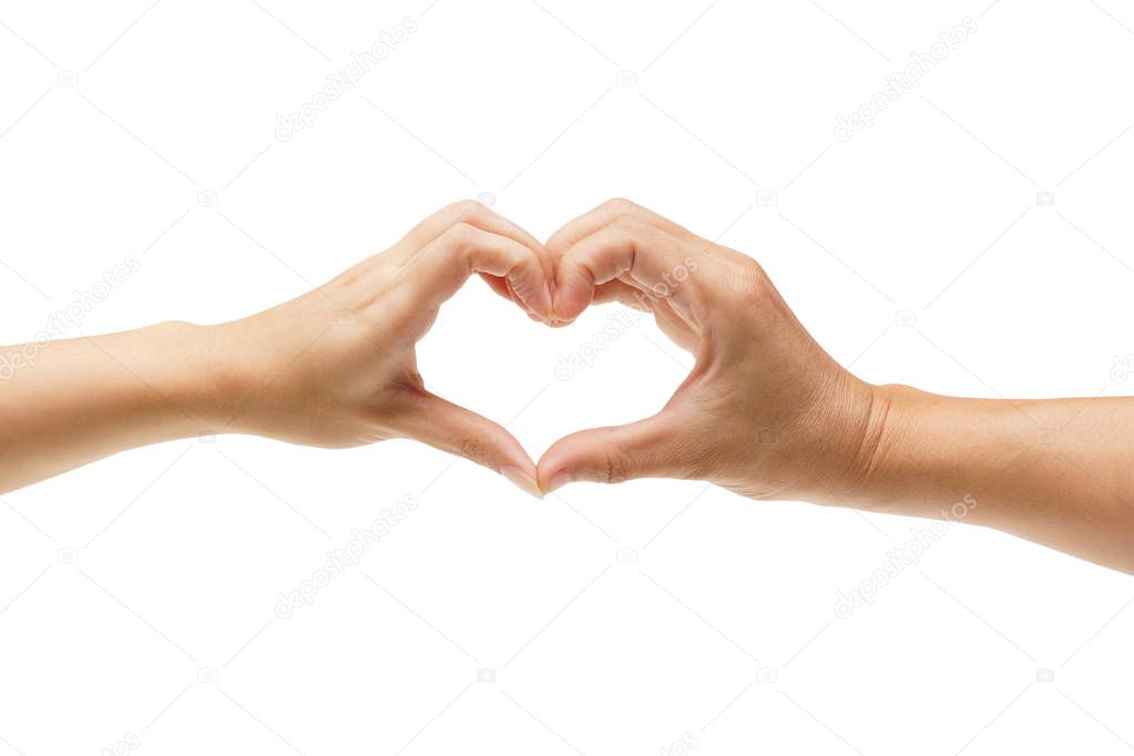 Hands of a couple forming a heart shape 