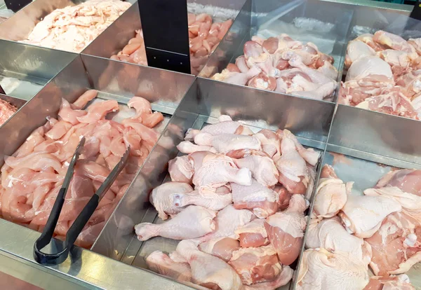 Different types of chicken meat on tray