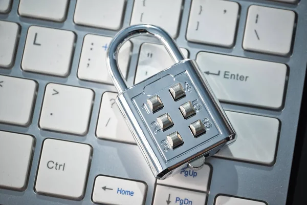Security lock on computer keyboard - Computer security and countermeasure on data encryption concept