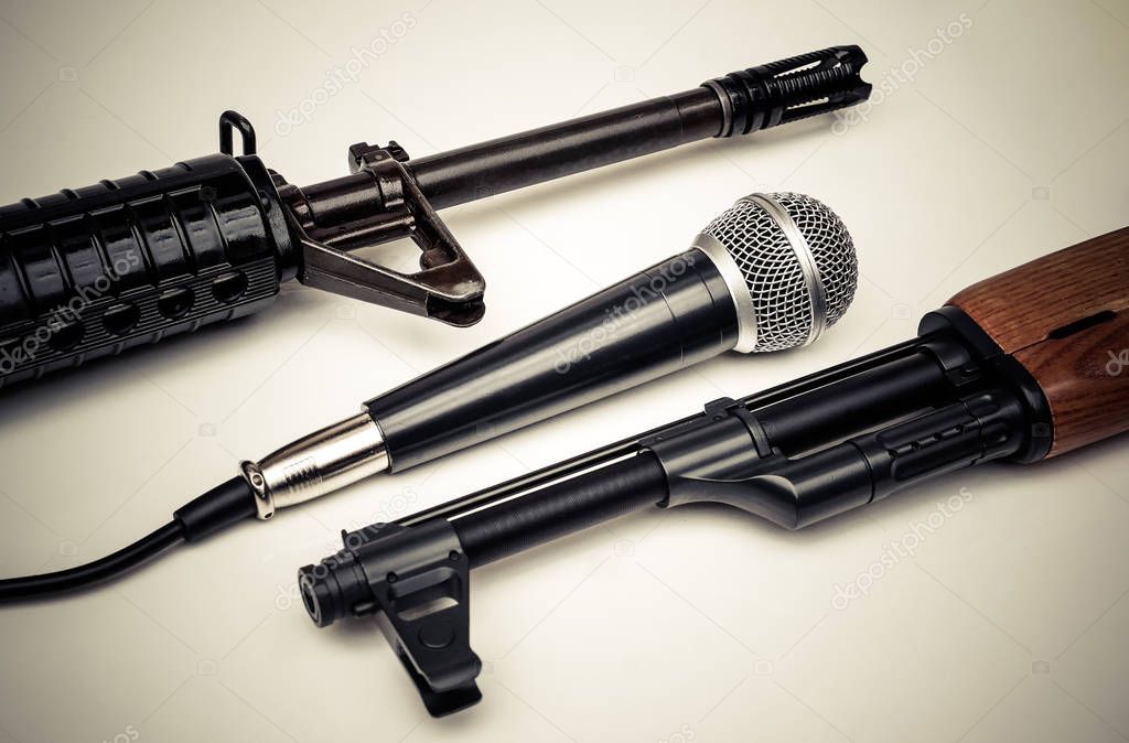 Microphone vs. Rifle / Freedom of the press is at risk concept / World press freedom day concept
