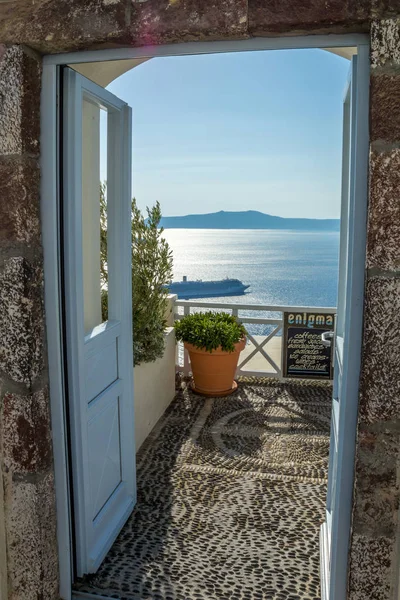 View through a door in Greece. Boat, cruise, framing, summer concepts.