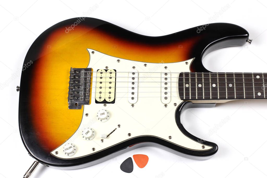 Six-string electric guitar isolated with shadow on white background