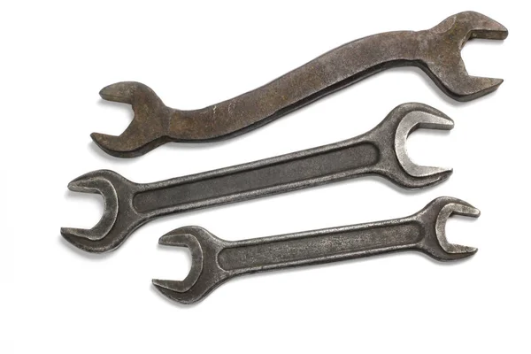 Old rusty stainless steel wrenches isolated on white top view — Stock Photo, Image