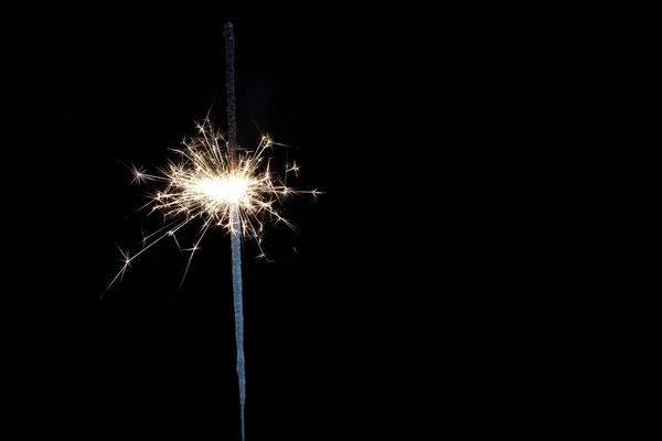 Burning Bengali Fire on black background. New year, Christmas, birthday Royalty Free Stock Images