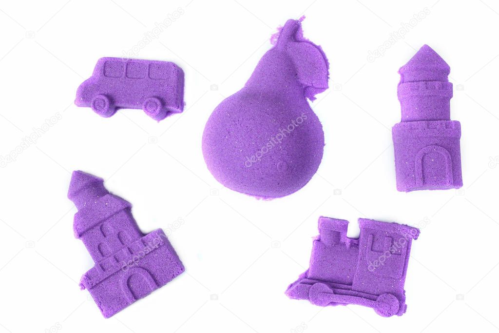 Purple kinetic sand, white background, shapes