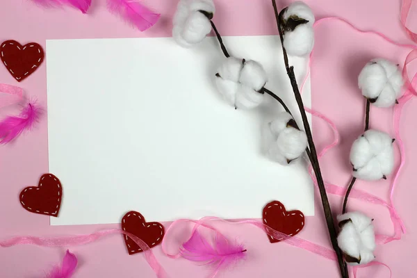 Frame of knitted hearts and gifts on a pink background. A branch of cotton. Space for text. Valentine's day, love and wedding concept — Stock Photo, Image