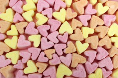 Pembe ve sarı şekerleme. Doku, arka plan. Sevgililer Günü konsepti, aşıklar, düğün