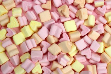 Pembe ve sarı şekerleme. Doku, arka plan. Sevgililer Günü konsepti, aşıklar, düğün