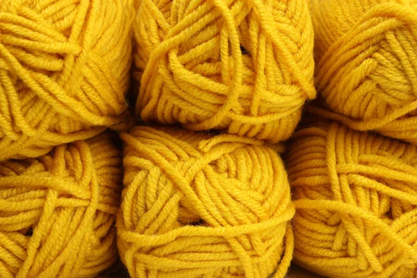 tangles of mustard-yellow threads close-up texture, background