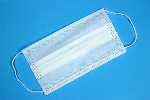 Surgical medical protective mask cover the mouth and nose. Procedure mask from bacteria. Protection concept.