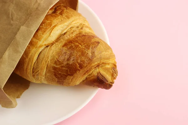 Croissant Paper Bag Plate Pink Background — Stock Photo, Image