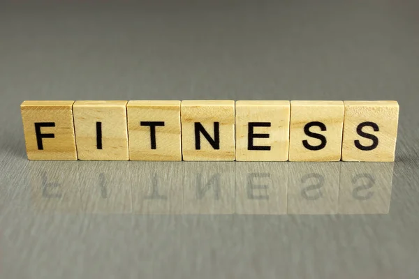 Wort Fitness Besteht Aus Quadratischen Holzbuchstaben Auf Grauem Hintergrund — Stockfoto