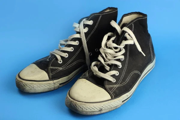 Black Old Sneakers Blue Background — Stock Photo, Image