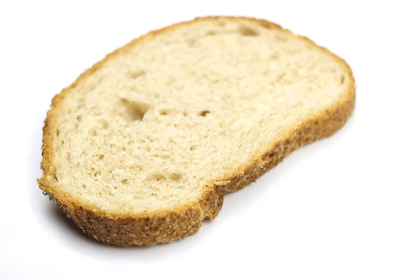 一片面包被白色的背景隔开了 — 图库照片